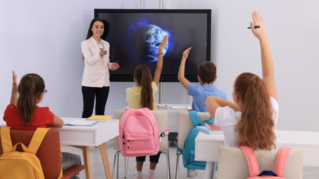 Comparison of an interactive display and a traditional whiteboard setup